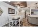 Bright dining area features decorative ceiling and light fixture, a white table with gray chairs, and hardwood floors at 13215 Peacock Dr, Lone Tree, CO 80124