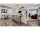 Open-concept kitchen flowing into the dining area and living room at 13215 Peacock Dr, Lone Tree, CO 80124