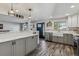 Modern kitchen featuring stainless steel appliances, grey cabinets, and new countertops at 13215 Peacock Dr, Lone Tree, CO 80124