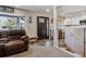 Inviting living room featuring hardwood floors, a staircase to the second level, and a large window at 13215 Peacock Dr, Lone Tree, CO 80124