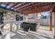 Hot tub and wooden pergola provide shade and privacy in the backyard at 13215 Peacock Dr, Lone Tree, CO 80124