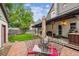 Backyard featuring a red brick patio, outdoor dining, and gazebo at 912 S Washington St, Denver, CO 80209
