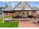 Backyard featuring a red brick patio, gazebo, and a built-in grill at 912 S Washington St, Denver, CO 80209