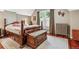 Cozy bedroom featuring a hardwood floor, a window, and a wood-framed bed with built-in drawers at 912 S Washington St, Denver, CO 80209