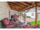 Inviting covered deck with comfortable seating and grill area provides a perfect spot for outdoor entertaining at 912 S Washington St, Denver, CO 80209