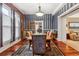 Elegant dining room with hardwood floors and unique striped walls at 912 S Washington St, Denver, CO 80209