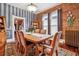 Charming dining room featuring a brick wall, vintage rug, and a classic wooden table with comfortable chairs at 912 S Washington St, Denver, CO 80209