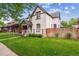 Charming home with a welcoming front porch and well-maintained lawn at 912 S Washington St, Denver, CO 80209