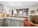 Spacious kitchen offering gray cabinets, tile backsplash, and a built-in mudroom area for enhanced functionality at 912 S Washington St, Denver, CO 80209