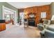 Cozy living room featuring a decorative fireplace with exposed brick at 912 S Washington St, Denver, CO 80209