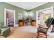 Comfortable living room with neutral carpet and cozy armchairs at 912 S Washington St, Denver, CO 80209