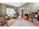 Inviting living room with neutral carpet and cozy armchairs at 912 S Washington St, Denver, CO 80209
