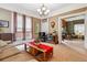 Cozy living room featuring a comfortable sofa, vintage TV, and a view to an adjacent room at 912 S Washington St, Denver, CO 80209