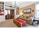 Comfortable living room showcasing built-in shelves, a cozy sofa, and a clear view into the adjacent dining area at 912 S Washington St, Denver, CO 80209