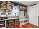 Cozy mudroom featuring a granite countertop desk, storage bench, and convenient built-in shelves and coat hooks at 912 S Washington St, Denver, CO 80209