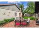 Brick patio features an outdoor dining set and greenery at 912 S Washington St, Denver, CO 80209