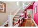 Beautiful staircase with hardwood steps and white banister at 912 S Washington St, Denver, CO 80209