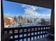 Beautiful view from the porch of snow-covered trees and mountains at 30819 Hilltop Dr, Evergreen, CO 80439