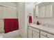Bathroom features shower, sliding glass doors, and vanity sink at 8867 Yukon St # 49, Broomfield, CO 80021