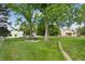 Scenic community park with picnic tables, mature trees, and walking path among the neighborhood homes at 8867 Yukon St # 49, Broomfield, CO 80021