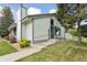 Inviting home with concrete steps, walkway, a bench, and decorative signage near the front door at 8867 Yukon St # 49, Broomfield, CO 80021