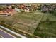 Aerial view of large lot featuring lush lawn, perimeter fencing, mature trees, and neighborhood views at 5397 Lenox Ct, Castle Rock, CO 80104