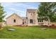 Expansive backyard featuring a patio, fire pit, and lush lawn, perfect for outdoor entertaining and Gathering fun at 5397 Lenox Ct, Castle Rock, CO 80104