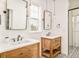 Charming bathroom with dual rustic wood vanities, decorative tile flooring, shiplap wall, and modern fixtures at 5397 Lenox Ct, Castle Rock, CO 80104