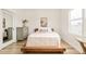Minimalist bedroom design featuring a low-platform bed, light wood floors, and a serene, uncluttered atmosphere at 5397 Lenox Ct, Castle Rock, CO 80104