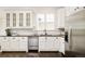 Elegant kitchen featuring white cabinets, subway tile backsplash, stainless steel appliances, and dark countertops at 5397 Lenox Ct, Castle Rock, CO 80104
