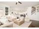 Open-concept living room with views of the kitchen and staircase, featuring stylish furnishings and decor at 5397 Lenox Ct, Castle Rock, CO 80104