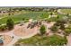 A large park playground features a variety of slides, swings, and play structures for endless fun at 5397 Lenox Ct, Castle Rock, CO 80104