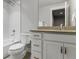 White bathroom featuring a shower over tub with white subway tile surround at 10000 E 59Th Dr, Denver, CO 80238