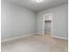 An empty bedroom with carpet floors and a walk-in closet at 10000 E 59Th Dr, Denver, CO 80238