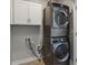 Modern laundry room equipped with stacked washer and dryer at 10000 E 59Th Dr, Denver, CO 80238