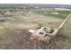 Expansive aerial view of the property, including the home, outbuildings, and surrounding landscape at 17445 County Road 6, Brighton, CO 80603