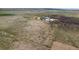 Overhead view of home, buildings, and surrounding acreage at 17445 County Road 6, Brighton, CO 80603