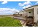 Back porch and well-maintained lawn at 17445 County Road 6, Brighton, CO 80603