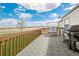 Back deck with beautiful views, outdoor grill and swing at 17445 County Road 6, Brighton, CO 80603