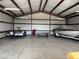 Spacious barn interior with metal frame, ready for equipment storage and various projects at 17445 County Road 6, Brighton, CO 80603