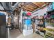Basement area with exposed ductwork, storage shelves and laundry facilities at 17445 County Road 6, Brighton, CO 80603