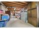 Spacious unfinished basement featuring exposed wooden beams and ample storage at 17445 County Road 6, Brighton, CO 80603