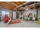 Unfinished basement with open ceiling, rug, and exterior access at 17445 County Road 6, Brighton, CO 80603