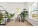 Light-filled room featuring tiled floors, natural light, and scenic backyard views at 17445 County Road 6, Brighton, CO 80603