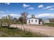 Exterior of property with swing set at 17445 County Road 6, Brighton, CO 80603