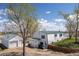 Aerial view of home with new roof, detached garage, and spacious yard at 17445 County Road 6, Brighton, CO 80603