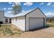 White detached garage with a large door at 17445 County Road 6, Brighton, CO 80603