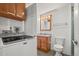 Laundry area with washer and dryer, adjacent to a bathroom with a vanity and toilet at 17445 County Road 6, Brighton, CO 80603