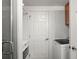 Laundry room with washer and dryer, built-in storage, and a door to the bathroom at 17445 County Road 6, Brighton, CO 80603
