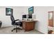 Office space with two monitors on a wooden desk with natural light at 17445 County Road 6, Brighton, CO 80603